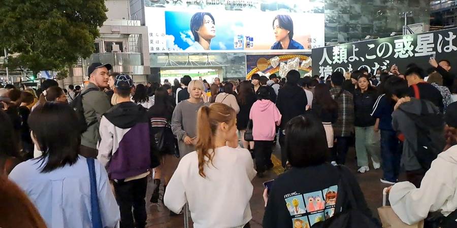 A group of people walking in a building