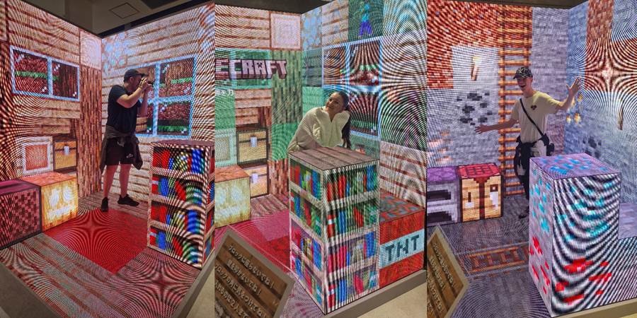 A person standing in front of a wall of boxes